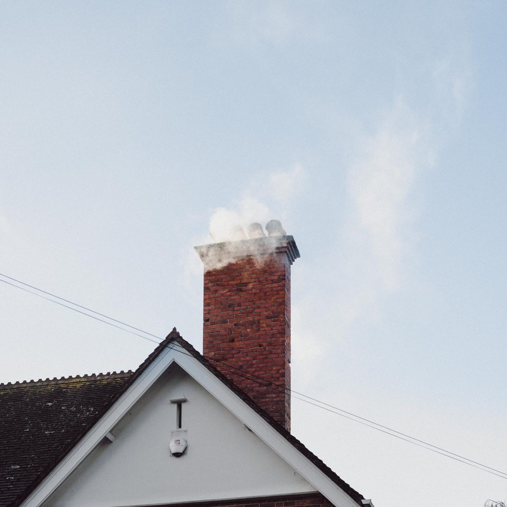 house with smoke coming out of the chimney